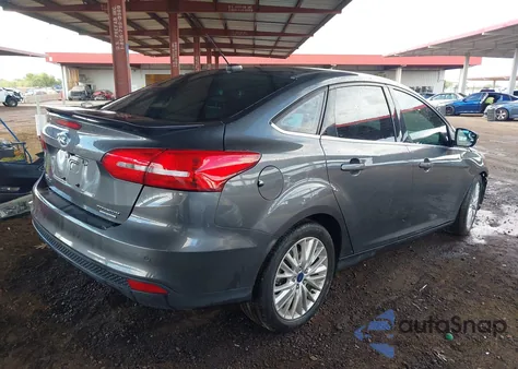 2016 Ford Focus Titanium from USA, damaged, VIN 1FADP3J21GL362772